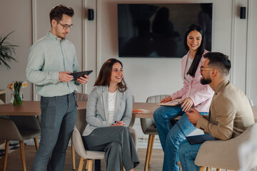 Business people having meeting using digital tablet in modern office