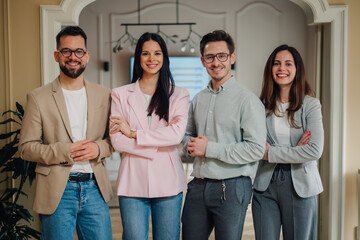 Startup business team smiling with confidence in modern office