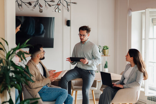 Business team discussing strategy during meeting in modern office
