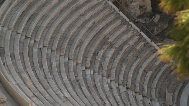 Odeon of Herodes Atticus stone Roman theatre on Acropolis of Athens, Greece. Ancient Greek architecture. Popular travel and touristic landmark