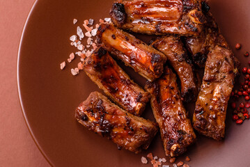 Meat, beef ribs in a marinade grilled with salt and spices. Grilled ribs
