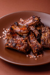 Meat, beef ribs in a marinade grilled with salt and spices. Grilled ribs