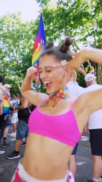 A Joyful and Vibrant Celebration at the Pride Parade with Colorful Outfits and Accessories