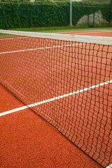 tennis court with net and ball