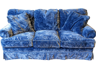 Plush, textured blue velvet sofa with pillows