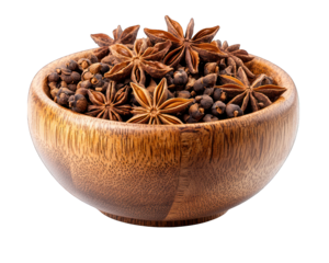 Star anise and peppercorns fill wooden bowl