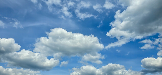Blue sky with white clouds. The background is a clear blue sky without any cumulus clouds.