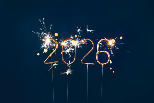 New Year 2026 Numbers made with Glowing Sparklers on Dark Background. - Powered by Adobe