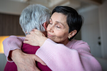 Trust and support in retired couple. Calm happy mature wife hugs husband with love, woman gives emotional support, family care, affection and understanding, caring in difficult times, emotional bond