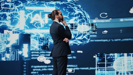 Tech savvy businessman employing AI brain data visualization, exploring algorithmic thinking and machine learning through neural networks system. Virtual intelligence in the digital age. Camera B.