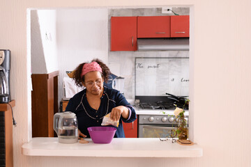 old latina woman making jelly