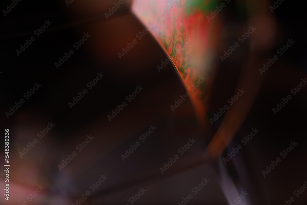 Fototapete red reflections of liquid in macro, red liquid surface, bubbles in macro, connection of bubbles in m