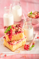 Homemade red currant yeast cake with glaze and crumble.