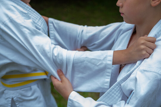 children learning life skills through martial arts, Partnered practice in judo, lesson in cooperation and mutual respect, goal-setting