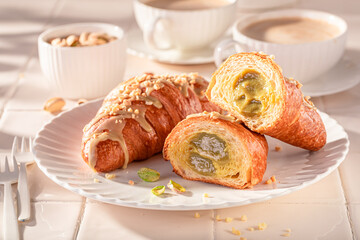 Tasty and traditionally pistachio croissants as french snack.