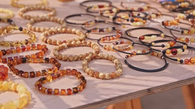 Valuable Jewelry Natural Amber Bracelet Sold on Outdoor Market Stand at Baltic Sea Resort in Poland