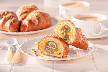 Sweet and delicious pistachio croissants as french snack.