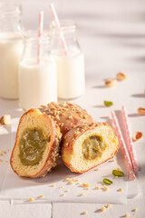 Fresh and tasty pistachio donuts as takeaway dessert.