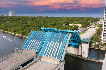 Colorful cloudy sky's near the 17th Street Causeway Bridge, E. Clay Shaw Jr. Bridge, Fort Lauderdale.  Bridge is fully up during afternoon.