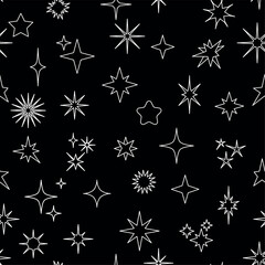 A vector illustration. Seamless pattern with collection of various white star shapes on a black background