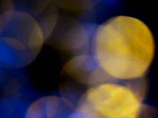 Abstract bokeh scene. Golden light leaks on black color background for design. Light effect.