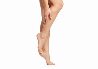 Close-up of smooth, feminine legs and feet on white background. Perfect for skincare, beauty, pedicure, and wellness themes. Showcasing elegance, grooming, and personal care.


