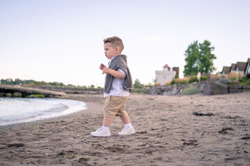 little boy running on the beach
