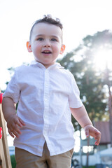 little boy playing in the playground