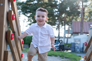 little boy playing on playground