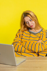 Displeased young adult woman using laptop notebook typing working, loses becoming surprised sudden...
