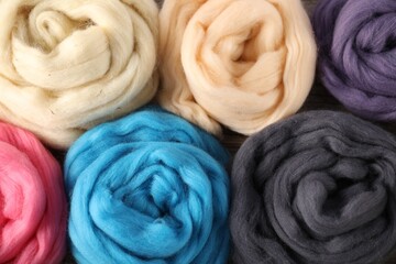 Colorful felting wool as background, closeup view