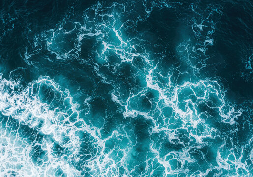 Abstract blue sea water with white foam for background