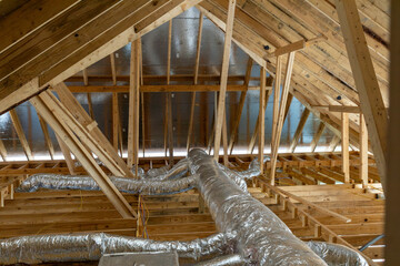 New home construction attic exposed rafters hvac duct work trusses 