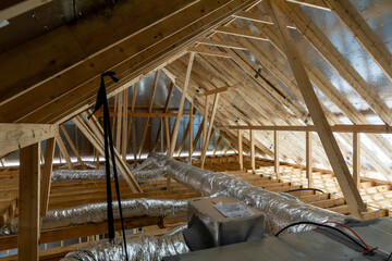 New home construction attic exposed rafters hvac duct work trusses 