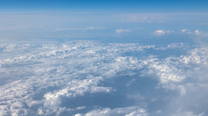 Experience the Captivating Aerial View of Beautiful Clouds and the Clear Blue Sky Above You