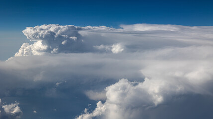 Experience the Captivating Aerial View of Beautiful Clouds and the Clear Blue Sky Above You