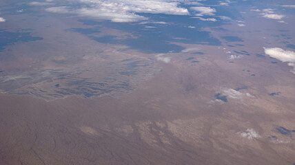 Fototapeta premium A breathtaking and wide Aerial View of an Expansive Landscape Filled with Beautiful Clouds Above
