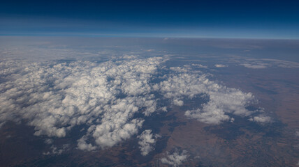 Experience the Captivating Aerial View of Beautiful Clouds and the Clear Blue Sky Above You