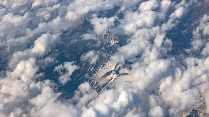 A Breathtaking Scenic Aerial View of Billowing Clouds Floating Above a Beautiful Landscape