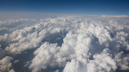 A Breathtaking Scenic Aerial View of Billowing Clouds Floating Above a Beautiful Landscape