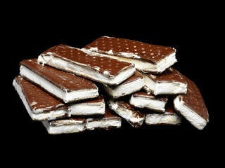 Stack of ice cream sandwiches on black background