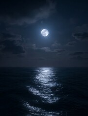 Glowing full moon floating in the night sky mirrored across the calm sea