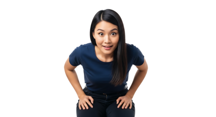 Surprised woman in blue shirt and black pants leaning forward with hands on knees looking at camera on transparent background