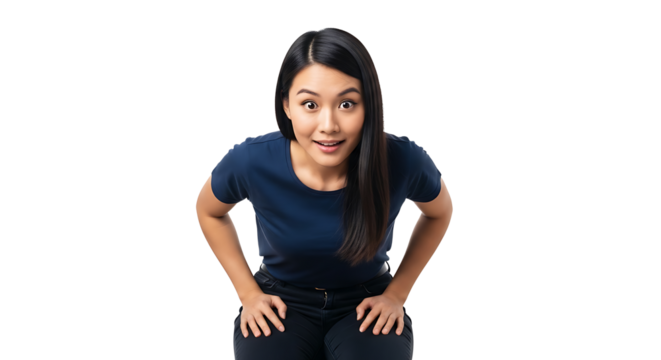 Surprised woman in blue shirt and black pants leaning forward with hands on knees looking at camera on transparent background