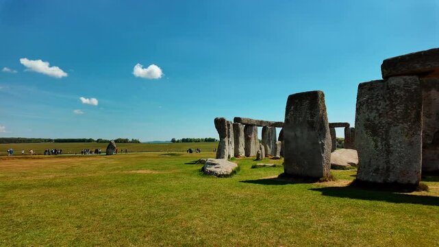 Prehistoric stone pillars and lintels form an iconic monument set on chalky ground at Stonehenge, Salisbury, Wiltshire, England, UK