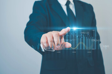 Business, finance and investment concept. Businessman using digital tablet analyzing and...