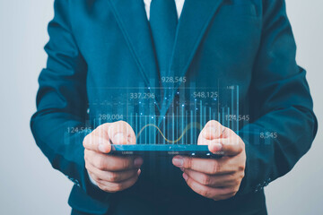 Business, finance and investment concept. Businessman using digital tablet analyzing and...