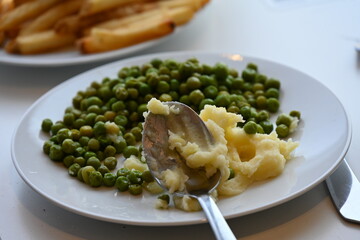 green peas and food on a plate