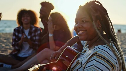 Happy young adult plus-size black woman playing acoustic guitar at sunset on the beach surrounded by diverse group of friends, enjoying summer vacation with music, laughter and the beauty of the ocean