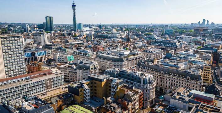 Aerial view of Hanover Square in London featuring green park space, surrounding classic architecture, and city streets on a clear day.